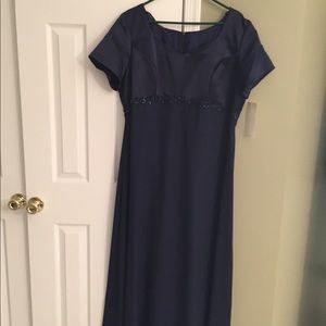 New gown.  Polyester with satin sheath underneath